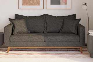 Lifestyle image of a DHP pillow back sofa in living room setting