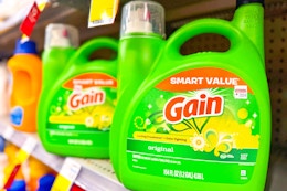 large bottles of gain detergent on a shelf