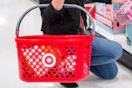 close up shot of someone holding a Target shopping basket