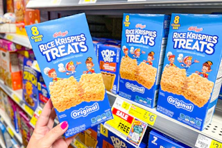 hand holding a box of rice krispies treats at dollar general