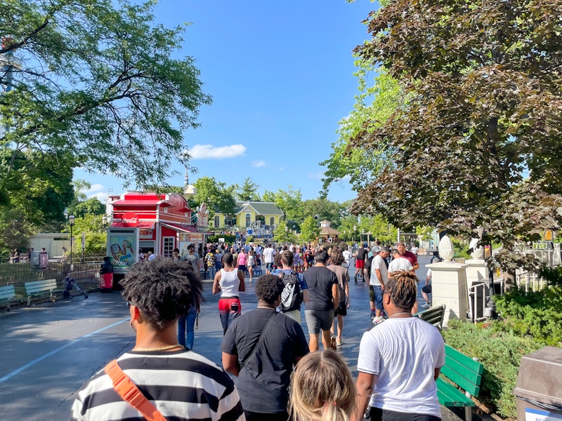 Crowds inside a Six Flags amusement park