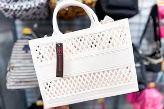 White No Boundaries Jelly Tote Bag in purse section of Walmart store