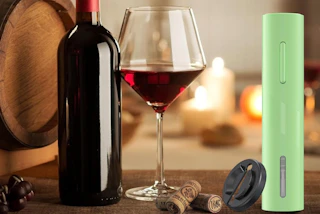 a lime green bottle opener next to a bottle and glass of wine 