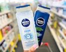 hand holding two nivea men body washes