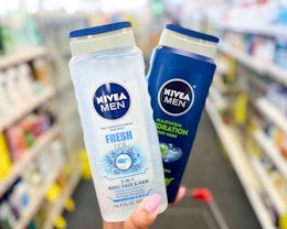 hand holding two nivea men body washes