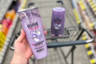 hand holding l'oreal elvive shampoo
