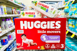 box of huggies diapers with 2 packs of huggies wipes on top of it