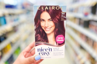 hand holding a box of clairol nice'n easy hair color