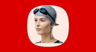 a woman wearing a swimming cap and headphones