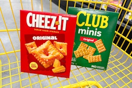 cheez-it and club crackers in a yellow shopping cart