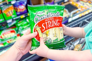 hands holding frigo cheeseheads