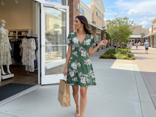 a woman wearing a wrap dress