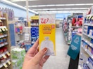 hand holding pack of walgreens brand trash bags