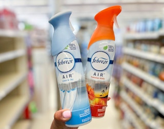 two cans of Febreze air freshener in aisle