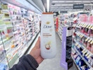 hand holding dove body wash in walgreens