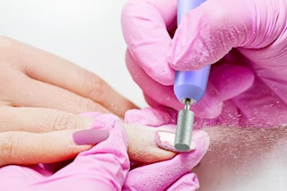 a nail drill being used on a drill