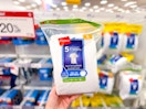 hand holding a pack of hanes kids' t-shirts at target