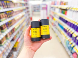 hand holding got2b hair wax sticks in walgreens