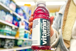 hand holding a bottle of vitaminwater