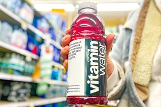 hand holding a bottle of vitaminwater