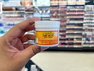 hand holding cantu curling cream
