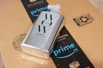 a silver pump bottle on an Amazon box