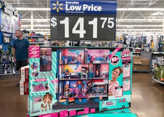 lol surprise omg real wood dollhouse with 85+ suprises in center of walmart aisle with large price sign
