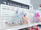 sharper image vacuums sitting on a target shelf