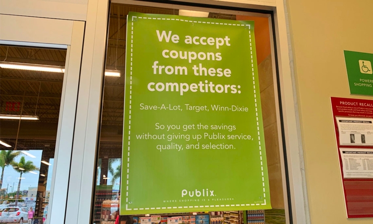 Sign showing Publix coupon policy, accepts coupons from Save-A-Lot, Target, Winn-Dixie