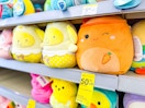 squishmallows plus on a shelf with a clearance tag