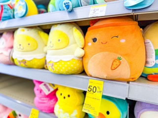 squishmallows plus on a shelf with a clearance tag