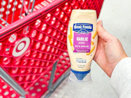 hand holding a bottle of best foods garlic aioli 