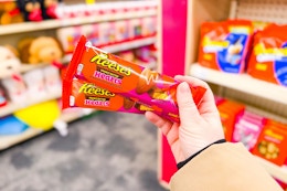 person holding reese's heart candy