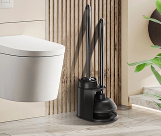 a toilet brush and plunger set next to a toilet