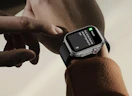a smart watch on a wrist with a message