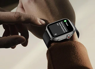 a smart watch on a wrist with a message