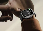 a smart watch on a wrist with a message