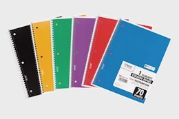 a stack of colorful notebooks 