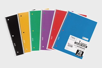 a stack of colorful notebooks 