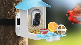 a bird flying to a smart bird feeder