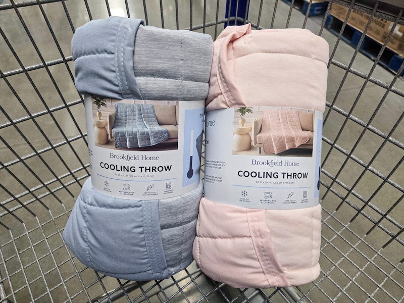 2 cooling throw blankets in a cart