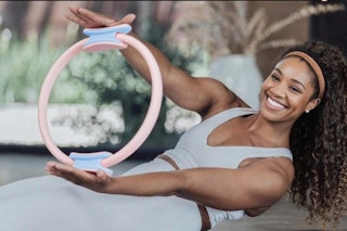 woman using pilates equipment