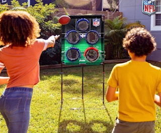 NFL football toss set outside with kids