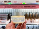 IT cosmetics makeup item in front of makeup shelf