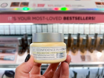 IT cosmetics makeup item in front of makeup shelf