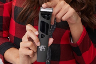 person holding the happy nuts the ballber pro