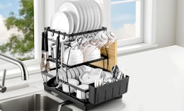 a dish drying rack next to a kitchen sink