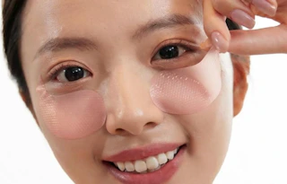 a person with pink under-eye patches