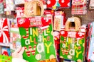 hand holding holiday gift bags