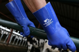 rubber gloves being worn near a farm